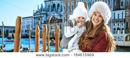 Happy Mother And Daughter Tourists In Venice, Italy In Winter