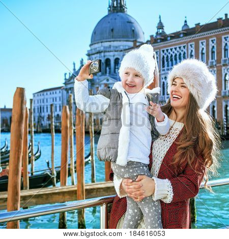 Mother And Child In Venice Taking Photo With Digital Camera