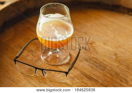 Wheat Ale On A Wooden Barrel