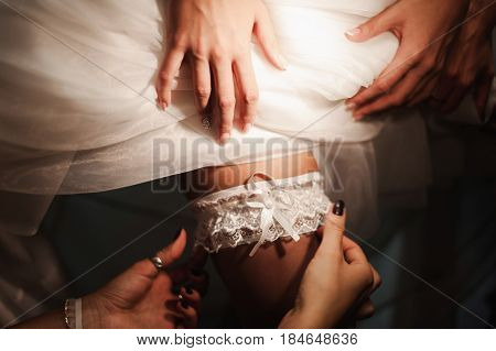 Portrait of beautiful bride with fashion veil posing at home at wedding morning. Makeup. Blondegirl with elegant hair styling. Wedding dress.