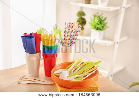 Colorful plastic ware for picnic on table