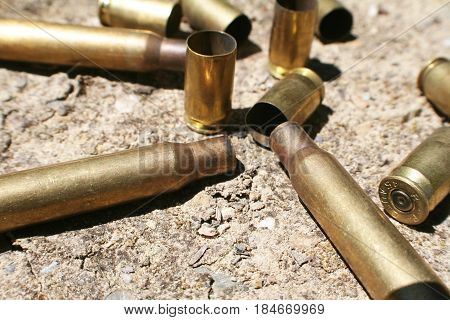 Bullet Casings On Desert Ground During War High Quality