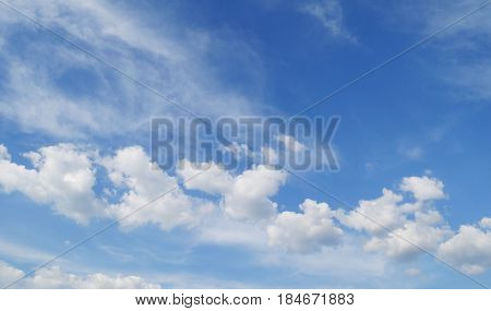 Blue sky and white clouds background with day light of summer use for natural environment concept.