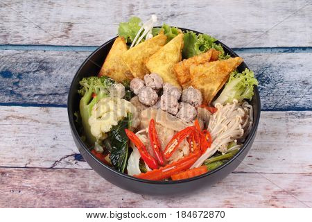 Crisy Wonton And Meat Ball In Chinese Kale Soup .