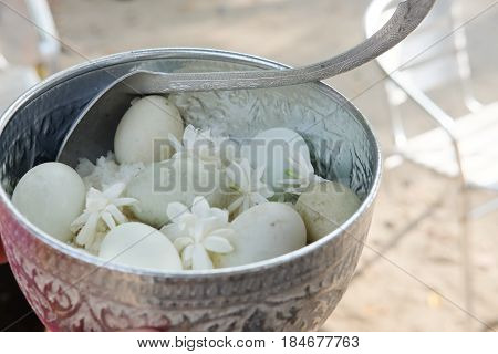 Cooking rice and boiled duck egg for give alms to a Buddhist monk Thailand traditional