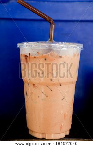 Iced mocha coffee in coffee shop with blue background