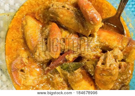 Orange coloured Prawns cooked and served in a bowl Indian delicacy food - called 