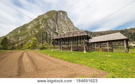 Traditional wooden double hayrack in small village of Studor near Bohinj in Slovenia during spring time