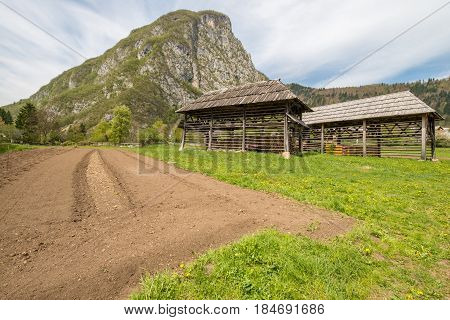 Traditional wooden double hayrack in small village of Studor near Bohinj in Slovenia during spring time