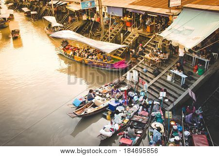 Samut Songkhram, Thailand - May 2, 2017: Amphawa Floating Market With Wooden Boats Busy Ferrying Peo