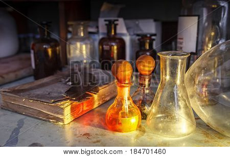 The old lab. The table of the alchemist. Laboratory table, stained with chemicals and poisons.