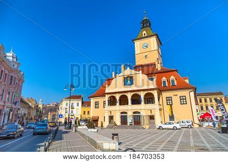 Brasov, Romania - March 24, 2015: The Council Square Piata Sfatului in downtown of Brasov, Transylvania, Romania and people