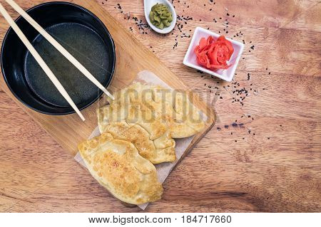 Japanese Gyoza dumplings on the wooden board