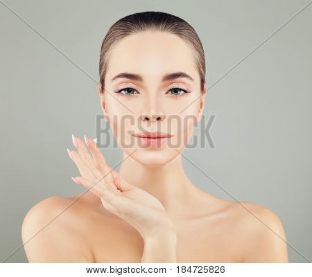 Beautiful Woman with a Moisturizer in her Hand. Spa Model Woman with Healthy Skin. Skincare Concept