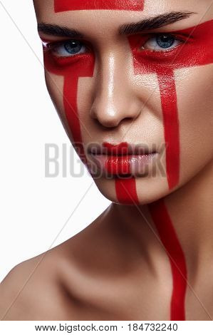 Beautiful Woman with futuristic tribal red Make-up