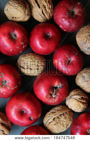 Red delicious apples on a black wooden table