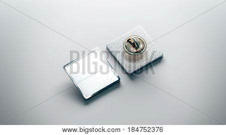 Blank white lapel pin mockup front and back side view 3d rendering. Empty luxury hard enamel badge mockup. Silver clasp-pin design template. Matal square brooch for logo presentation.