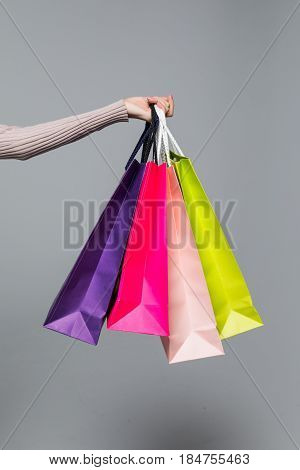 Young Summer Shopping Woman With Shopping Bags Isolated On Grey Background