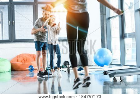 Young Fitness People Exercising With Skipping Ropes At Sports Center