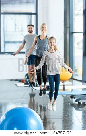 Young Fitness People Exercising With Skipping Ropes At Sports Center