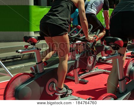 Group Of Boys And Girls At Gym: Workout With Spinning Bikes