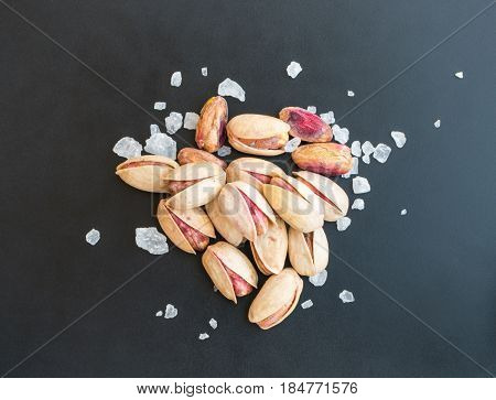 Heap Of Inshell Pistachios And Peeled Pistachios With Large Salt Crystals