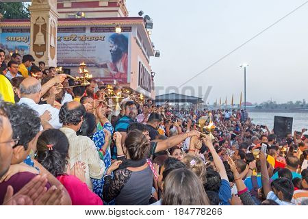 INDIA, RAM JHULA - APRIL 8, 2017: Hindoes doing puja at the Parmath Ashram at the river Ganges in Ram Jhula, India on 8th of april 2017
