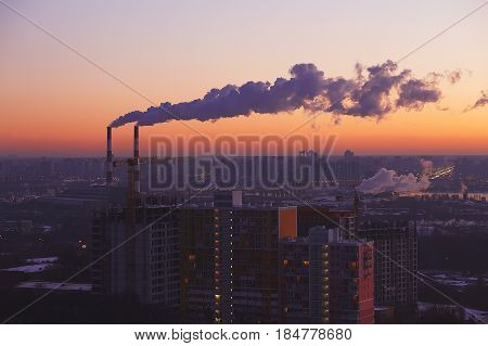 Two Industrial Tubes, Sunrise City View, Pink Warm Sky.