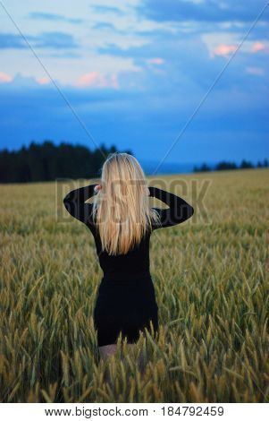 blonde girl in the field of corn