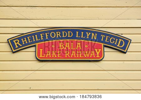 Bala Wales UK - May 3 2017: Station sign at the Bala Lake Railway or Rheilffordd Llyn Tegid in Welsh at Llanuwchllyn station a narrow gauge steam train heritage line run by volunteers and reopened in 1972