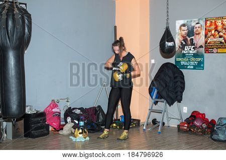 CRACOW POLAND - FEBRUARY 12 2016: Agnieszka Niestoj - talented Polish boxer durning boxing training with coach in the gym. Cracow Poland