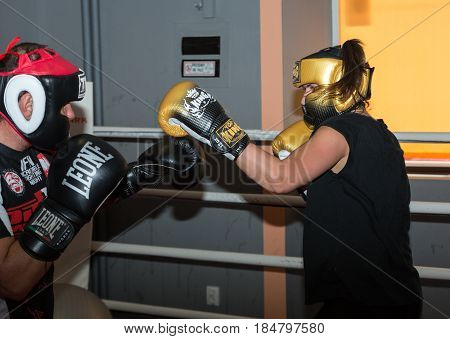 CRACOW POLAND - FEBRUARY 12 2016: Agnieszka Niestoj - talented Polish boxer durning boxing training with coach in the gym. Cracow Poland