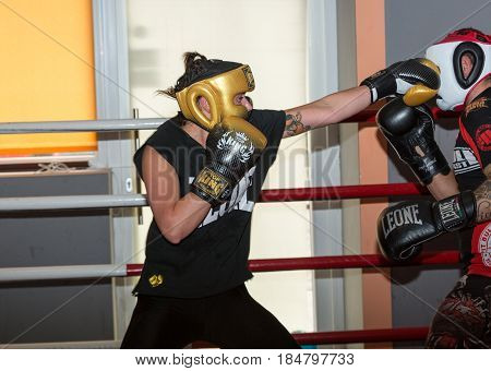 CRACOW POLAND - FEBRUARY 12 2016: Agnieszka Niestoj - talented Polish boxer durning boxing training with coach in the gym. Cracow Poland