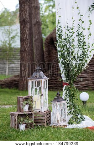 Beautiful Wedding Ceremony Outdoors. Decorated Chairs Stand On The Grass. Wedding Arch Made  Flowers