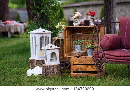Beautiful Wedding Ceremony Outdoors. Decorated Chairs Stand On The Grass. Wedding Arch Made  Flowers