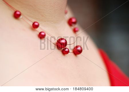 woman model with red pearl necklace ..