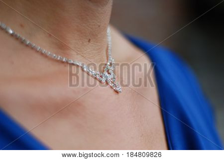 young woman in dress with silver necklace