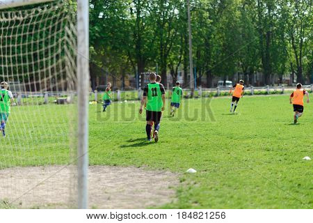 Players on the football field, amateur football
