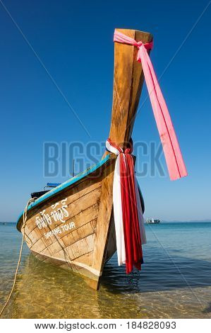 CRABI PROVINCE THAILAND - FEBRUARY 04 2015: Traditional thai long tail boat waiting for tourists to travel to beautiful islands in Thailand
