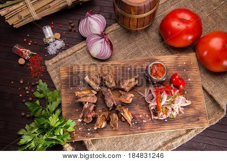 Mutton sunflower seeds with sauce ajika, is served with onions salad