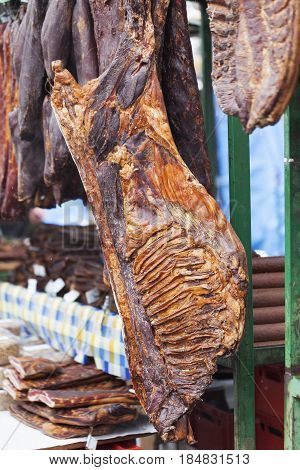 Home Made Smoked Bacon Hanging In The Stalls
