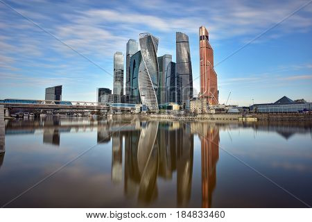 MOSCOW/ RUSSIA - MAY 1, 2017. Moscow International Business Center and pedestrian bridge Bagration on a summer morning. Moscow, Russia