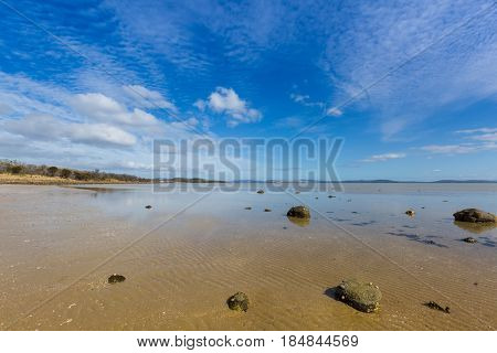 Peaceful afternoon at Dunalley Beach, Frederic Henry Bay, east coast of Tasmania, along Arthur highway, Australia