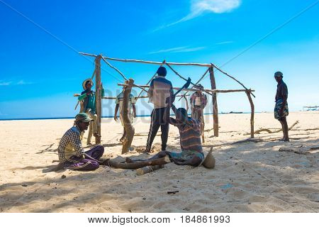 SRI LANKA - Mach 23: Local fishermen pull a fishing net from Indian Ocean on Mach 23, 2017 in Kosgoda, Sri Lanka. Fishing in Sri Lanka is the way they earn their living.