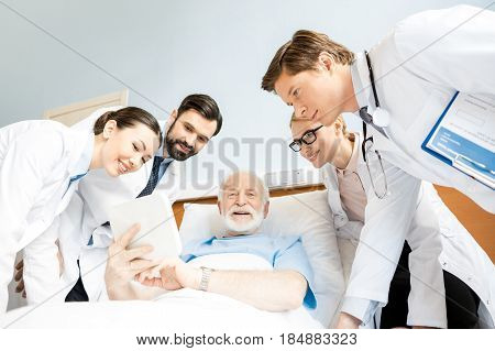 Doctors And Senior Patient