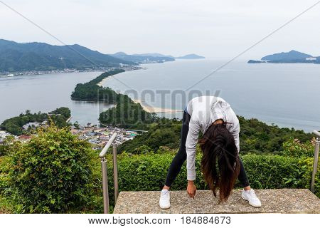 Woman viewing of Amanohashidate in Kyoto