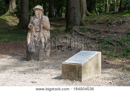 VERDUN FRANCE - AUGUST 19 2016: Memorial tablet and woodcarving soldier in Fleury French village completely destroyed in First World War One