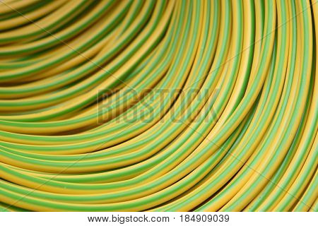 Closeup roll of yellow and electric cable