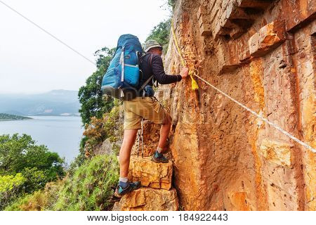 Hiking in famous Lycian Way in the Turkey. Backpacker in the trail.