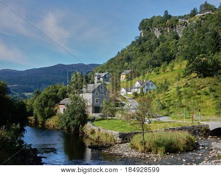 house in the mountains by the river